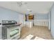 Unfinished kitchen with stainless steel appliances, tiled floor, and blue walls at 4008 Crockers Lake Blvd # 13, Sarasota, FL 34238