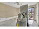 The laundry room has a water heater, washer, dryer, sliding glass doors, and ceiling fan at 4008 Crockers Lake Blvd # 13, Sarasota, FL 34238