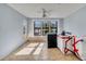 The living room has tiling, a ceiling fan, windows, and a door to the outside at 4008 Crockers Lake Blvd # 13, Sarasota, FL 34238
