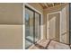 A screened-in patio with a sliding glass door and an outdoor storage area at 4008 Crockers Lake Blvd # 13, Sarasota, FL 34238
