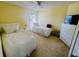 Bedroom with twin beds, white dressers, and a window offering natural light at 4515 50Th W Dr, Bradenton, FL 34210