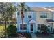 Charming townhome showcasing colorful exteriors, lush landscaping, and inviting curb appeal at 4658 Sabal Key Dr, Bradenton, FL 34203