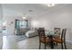 Bright living area with tile flooring, fan, dining nook, and comfortable sectional sofa at 4658 Sabal Key Dr, Bradenton, FL 34203