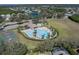 Aerial view of the community pool, tennis and basketball courts, and playground at 4658 Sabal Key Dr, Bradenton, FL 34203