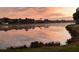 Peaceful lake view at sunrise with reflective pastel sky at 4941 Sabal Lake Cir, Sarasota, FL 34238