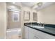 Bathroom featuring a tub-shower combo, a mirror, and a vanity at 503 Park Dr, Bradenton, FL 34209