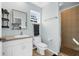 Bathroom with a tiled shower, modern vanity, and neutral color palette offers a clean and functional design at 503 Park Dr, Bradenton, FL 34209