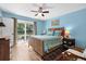 Comfortable bedroom with hardwood floors, and sliding door access to the outdoors at 503 Park Dr, Bradenton, FL 34209