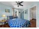 Bedroom with light blue walls, stylish furnishings, and a window to bring in natural light at 503 Park Dr, Bradenton, FL 34209