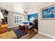 Cozy bedroom with hardwood floors, a large window, and beach-themed decor at 503 Park Dr, Bradenton, FL 34209
