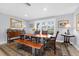 Inviting dining area with hardwood table, neutral walls, and a large colorful rug at 503 Park Dr, Bradenton, FL 34209