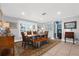 Dining room with a rustic table, wicker chairs, bench seating and tile floors at 503 Park Dr, Bradenton, FL 34209