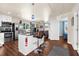 Bright kitchen features stainless steel appliances, granite counters, and a stylish central island with bar seating at 503 Park Dr, Bradenton, FL 34209