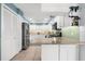 Modern kitchen with stainless steel appliances, granite countertops, and white cabinetry at 503 Park Dr, Bradenton, FL 34209