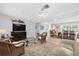 Comfortable living room with a large TV, wicker chairs, and a stylish glass coffee table at 503 Park Dr, Bradenton, FL 34209