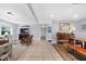 Spacious living room with tile floors, neutral walls and doorway to dining room at 503 Park Dr, Bradenton, FL 34209