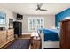 Comfortable main bedroom featuring hardwood floors, ceiling fan, and plenty of natural light from the large window at 503 Park Dr, Bradenton, FL 34209