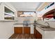 Well-equipped outdoor kitchen with stainless steel grill, sink, and wood cabinetry, perfect for outdoor dining at 503 Park Dr, Bradenton, FL 34209