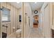 Functional bathroom showing a toilet, a towel rack, a small window, and access to a bedroom at 5141 Lansdowne Way, Palmetto, FL 34221
