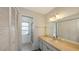 Bathroom with a shower, vanity with mirror, and ample storage space at 515 Rousseau Dr, Nokomis, FL 34275