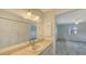 Bathroom featuring a sink, a vanity, and mirrored closet doors at 515 Rousseau Dr, Nokomis, FL 34275