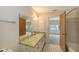 Bathroom with a vanity, mirror, and access to the bedroom and the toilet at 515 Rousseau Dr, Nokomis, FL 34275