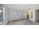 Bedroom featuring a ceiling fan, multiple windows, and access to a bathroom at 515 Rousseau Dr, Nokomis, FL 34275