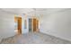 Spacious bedroom with a ceiling fan and access to multiple rooms at 515 Rousseau Dr, Nokomis, FL 34275