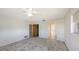 Bedroom featuring a ceiling fan, window, and access to a closet and bathroom at 515 Rousseau Dr, Nokomis, FL 34275