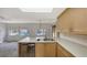 Kitchen featuring a stainless steel dishwasher and lots of countertop space and cabinet storage at 515 Rousseau Dr, Nokomis, FL 34275