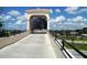 Covered pedestrian bridge over Legacy Trail offers safe passage and scenic views at 515 Rousseau Dr, Nokomis, FL 34275