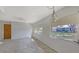 Bright living room featuring windows offering great natural light and a charming ceiling fan at 515 Rousseau Dr, Nokomis, FL 34275