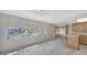 Bright interior space with a ceiling fan, large windows, and sliding glass doors creating an open and airy atmosphere at 515 Rousseau Dr, Nokomis, FL 34275