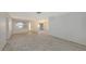 Spacious living room with natural light, featuring a chandelier and openings that create an airy atmosphere at 515 Rousseau Dr, Nokomis, FL 34275
