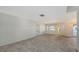 Bright and spacious living area with a large window and doorway, offering ample natural light and design potential at 515 Rousseau Dr, Nokomis, FL 34275