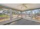 Enclosed patio with a ceiling fan and multiple windows offering outdoor views at 515 Rousseau Dr, Nokomis, FL 34275