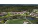 Aerial view of the community featuring condo buildings, a lake, and a golf course at 5320 Hyland Hills Ave # 2222, Sarasota, FL 34241