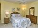 Comfortable bedroom with ceiling fan, yellow walls, and wicker furniture at 5320 Hyland Hills Ave # 2222, Sarasota, FL 34241