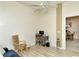 Cozy den with a ceiling fan, desk, chair, and stylish decor at 5320 Hyland Hills Ave # 2222, Sarasota, FL 34241