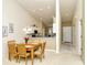 Cozy dining area showcasing a wooden table and chairs adjacent to the modern kitchen at 5320 Hyland Hills Ave # 2222, Sarasota, FL 34241