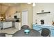 Open dining area adjacent to a modern kitchen, offering a view of the stainless steel appliances at 5320 Hyland Hills Ave # 2222, Sarasota, FL 34241