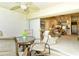 Relaxing screened lanai with ceiling fan and view into the home's living spaces at 5320 Hyland Hills Ave # 2222, Sarasota, FL 34241