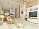 Spacious living room with high ceilings open to the kitchen and dining areas for easy entertaining at 5320 Hyland Hills Ave # 2222, Sarasota, FL 34241