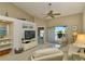 Open-concept living area features neutral tones, high ceilings, and access to an outdoor patio at 5320 Hyland Hills Ave # 2222, Sarasota, FL 34241