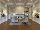 Inviting lobby featuring a fireplace, hardwood floors, comfortable seating, and decorative lighting at 5320 Hyland Hills Ave # 2222, Sarasota, FL 34241