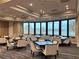 Meeting area with tables, comfortable seating, and large windows offering scenic views at 5320 Hyland Hills Ave # 2222, Sarasota, FL 34241