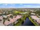 Aerial view of the community showing the house, surrounded by lakes, and trees at 5539 Octonia Pl, Sarasota, FL 34238