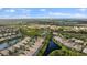 Aerial shot of the residential area, with the residence indicated, and a central lake at 5539 Octonia Pl, Sarasota, FL 34238