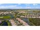 Extensive aerial view of the community with waterfront properties and beautiful ponds and mature trees at 5539 Octonia Pl, Sarasota, FL 34238