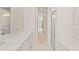 Well-lit bathroom with double vanity, neutral decor, and glass shower stall at 5539 Octonia Pl, Sarasota, FL 34238